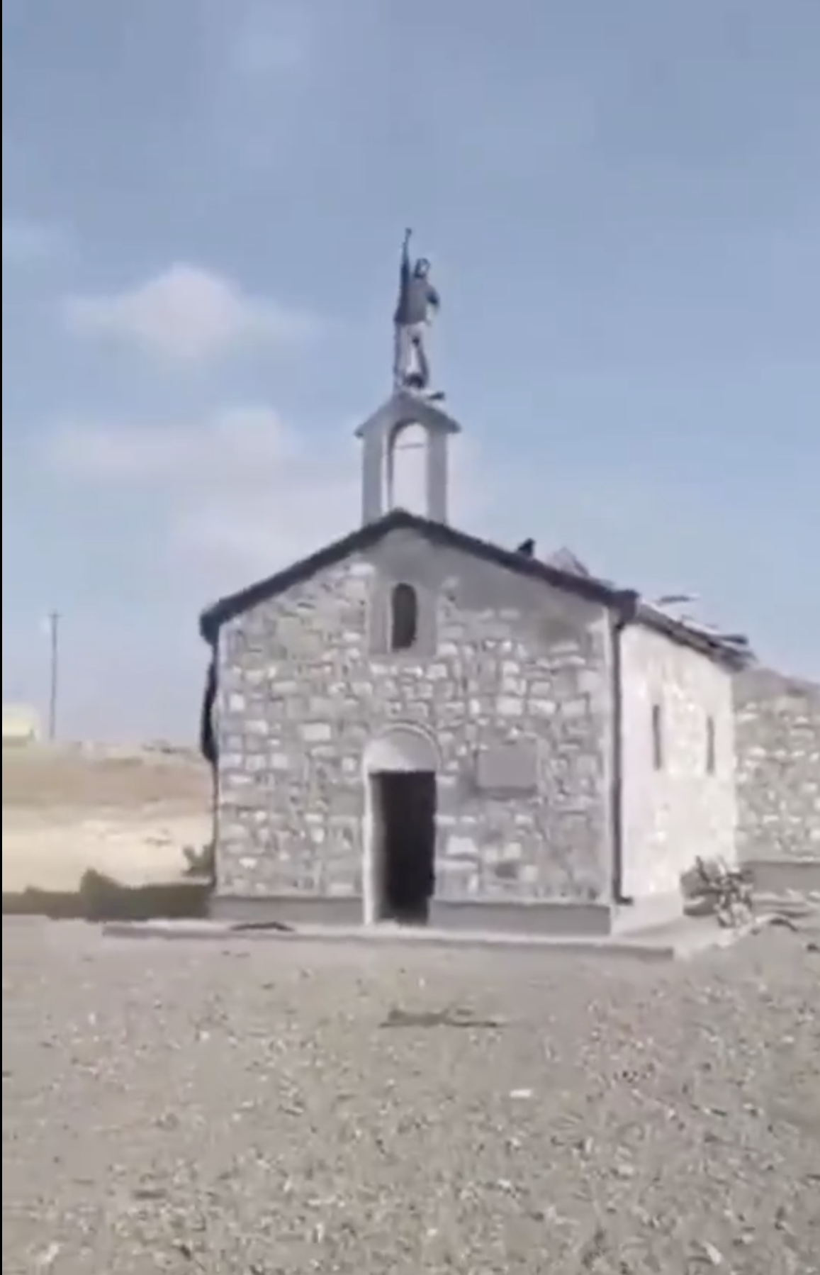 Azerbaijanis Disrespecting An Armenian Church In Occupied Artsakh, Standing On The Cross They Broke, Praising Allah.